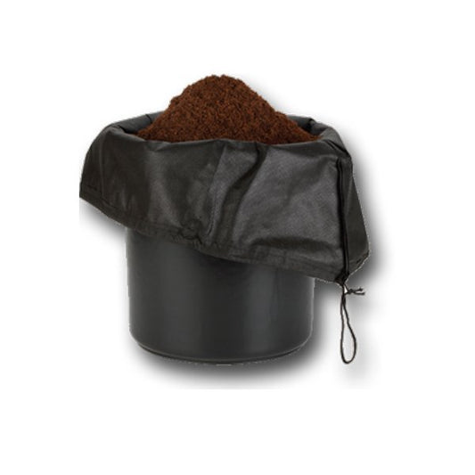 black pot with black mesh bag inside with soil