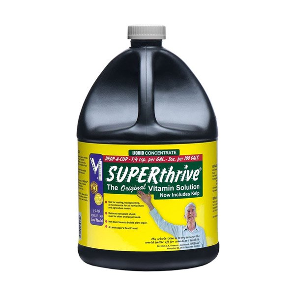 1 gallon of Superthrive packaged in black bottle with handle.