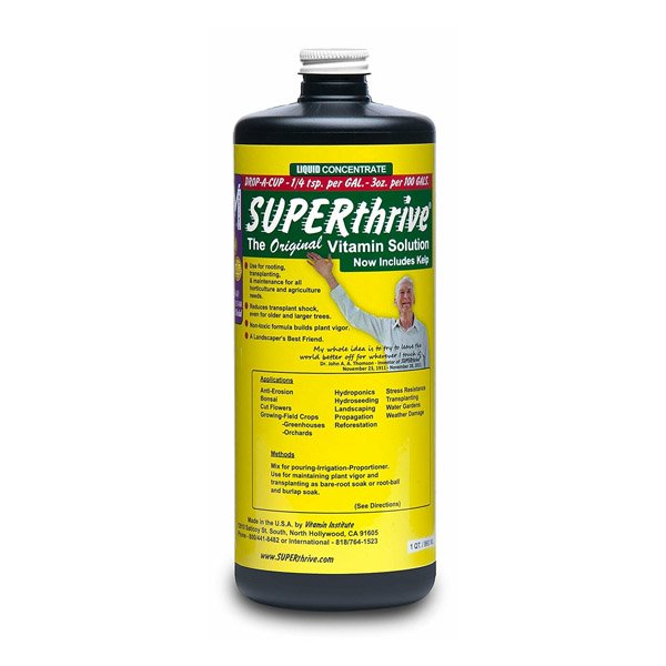 960ml of Superthrive packaged in black cylindral bottle with silver screw cap.